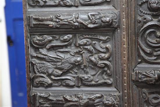 A 17th century Flemish carved oak coffer front, overall 5ft 7in. x 2ft 3in.